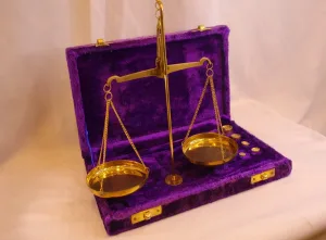 Antique brass balance scale with calibration weights